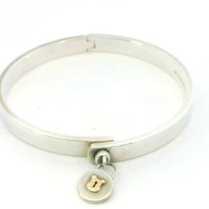 Tiffany & Co. Sterling and 18k lock charm 6.5" Bangle Bracelet D-529